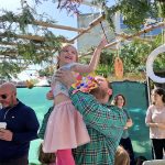 Father-Holding-Daughter-at-Sukkot-Event