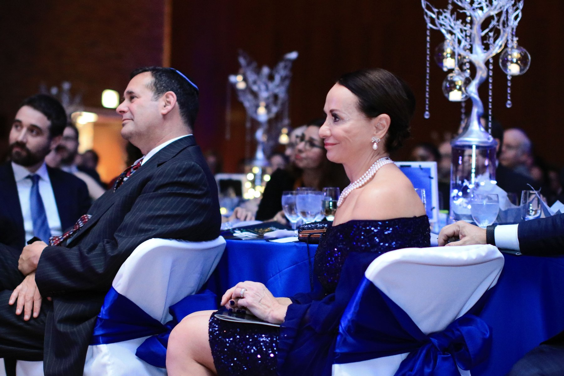 gala-organizer-sitting-table-speech