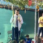 Rabbi Glick teaching in the Sukkah